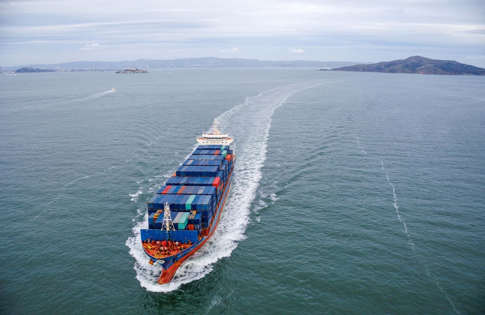 Cargo ship at sea, carrying containerised freight